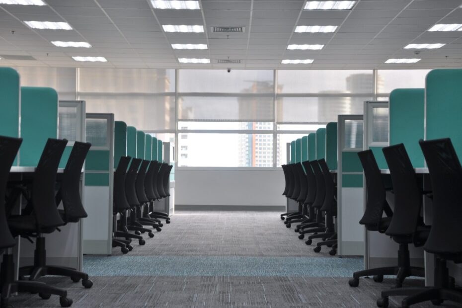 An image of an empty office with large bright windows