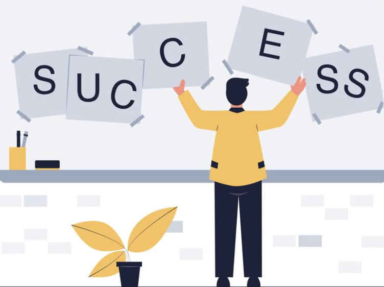 An image for employees holding pieces of paper for the word Success.