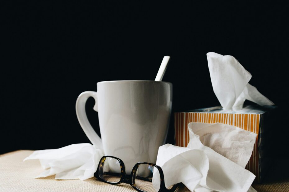 An image of a cup of tea, glasses and tissues put on the disc to explain that someone is having a flu.