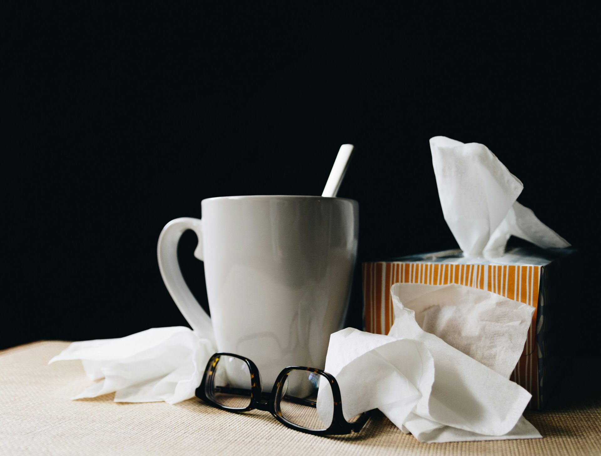 An image of a cup of tea, glasses and tissues put on the disc to explain that someone is having a flu.