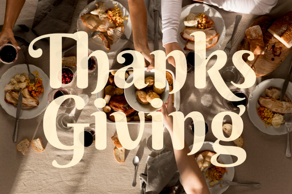 A Thanksgiving dinner gathering with family and friends around a table. The table is filled with traditional dishes like roasted turkey, vegetables, bread, and wine. The word "Thanksgiving" is overlaid in a large, classic font, highlighting the festive and communal spirit of the holiday.