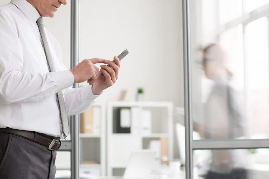 an employee holding his phone