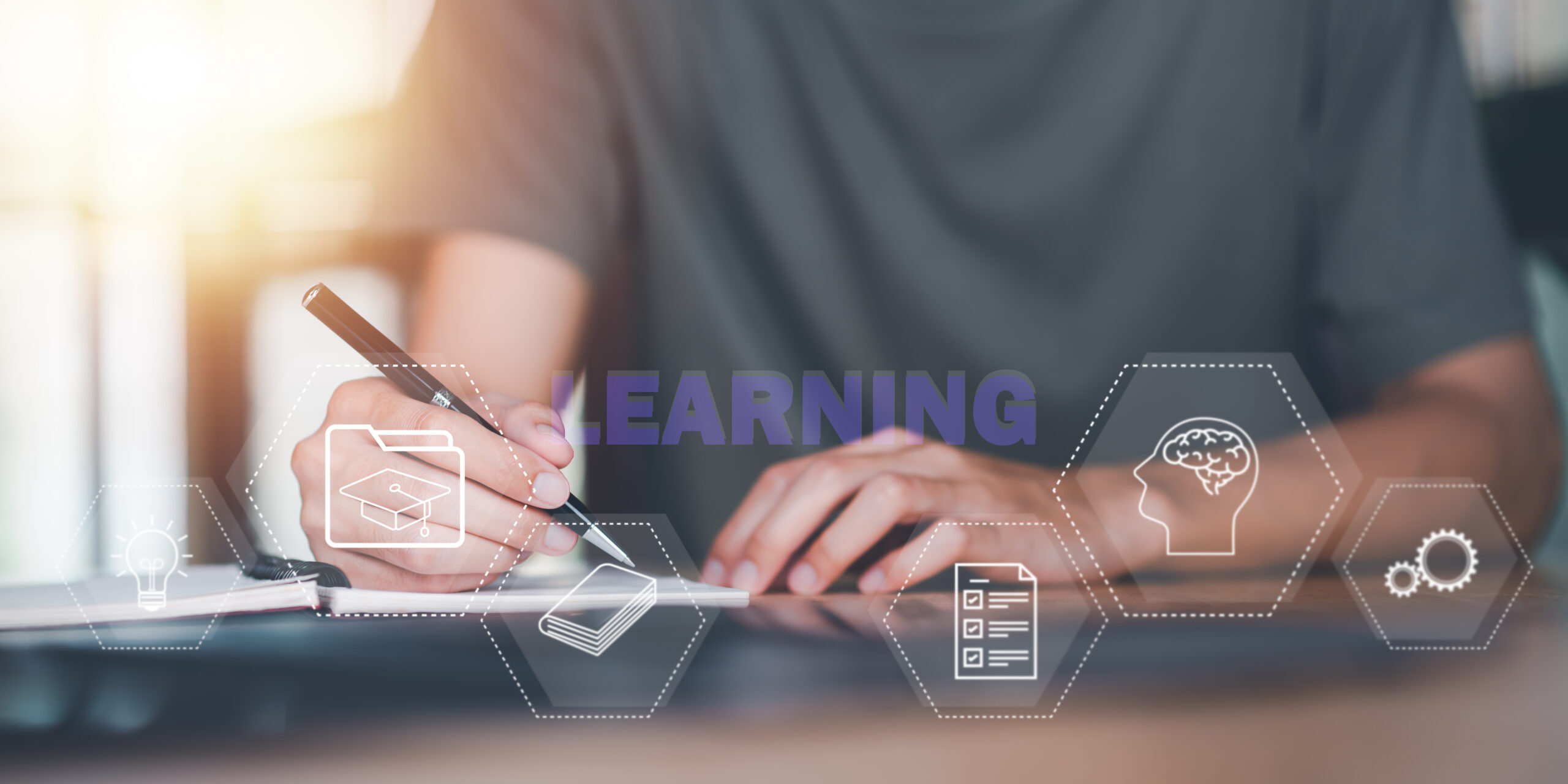 An image of a man learining on microlearninf platforms