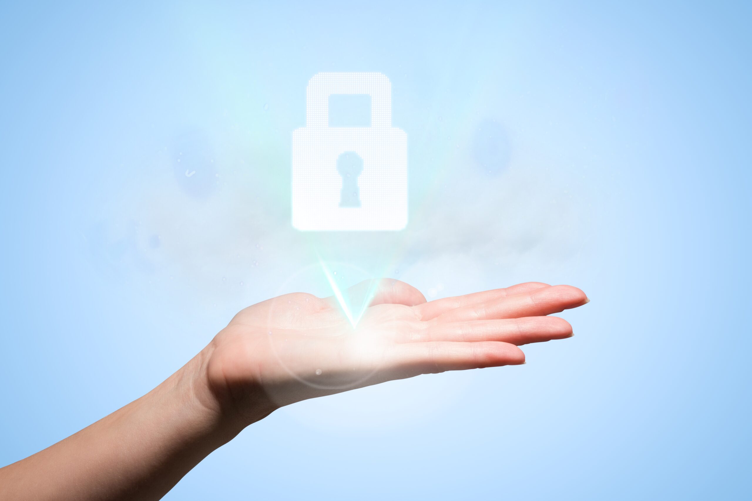 : A hand holding a glowing digital padlock icon, symbolizing secure access and identity protection through Single Sign-On (SSO) technology.